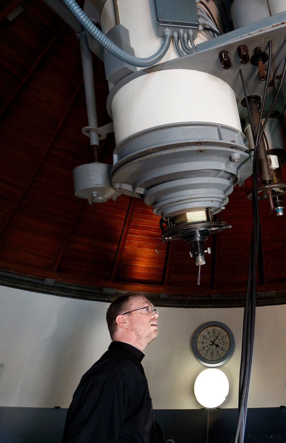 Jesuit Brother Bob Macke looks at a telescope while giving a tour of the Vatican Observatory to journalists at the papal villa at Castel Gandolfo, Italy, Sept. 28, 2018. Brother Macke said that by studying the universe, “we can better appreciate the God who created it.”